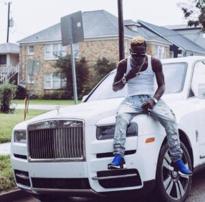 Photo of Shatta Wale siting on his Rolls Royce with singlet in the US. 
