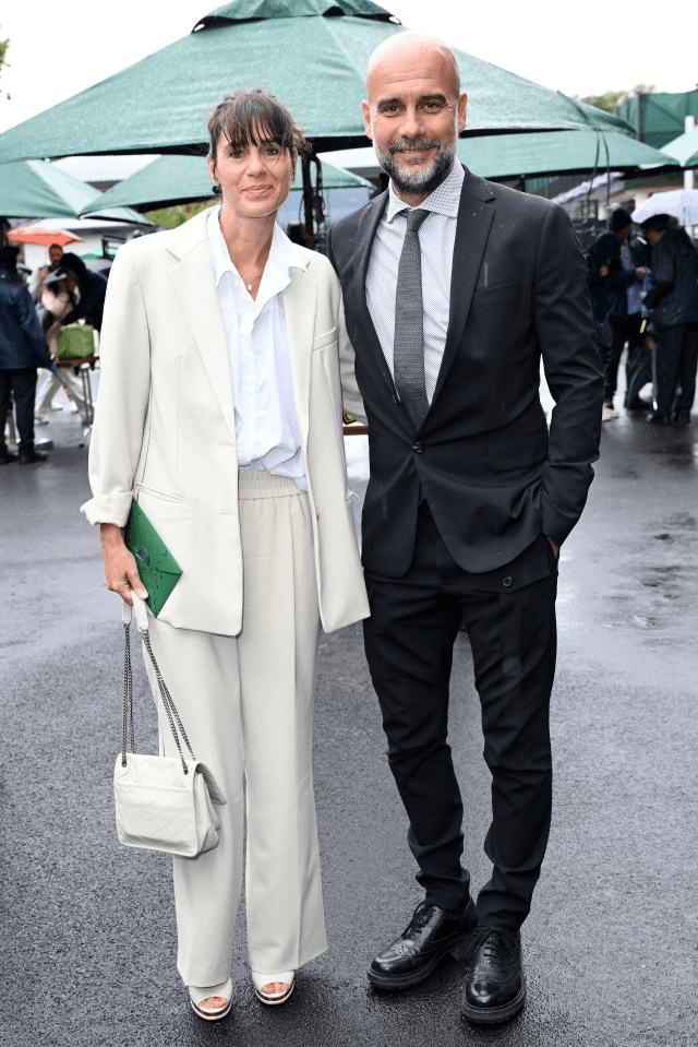 Pep Guardiola and wife  photo source @GettyImages via TheSun