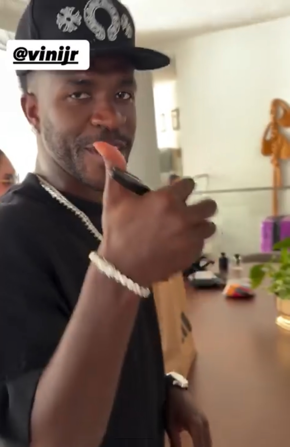 Vinicius Jnr. gives his fans thumbs up after signing customized jersey for a fan