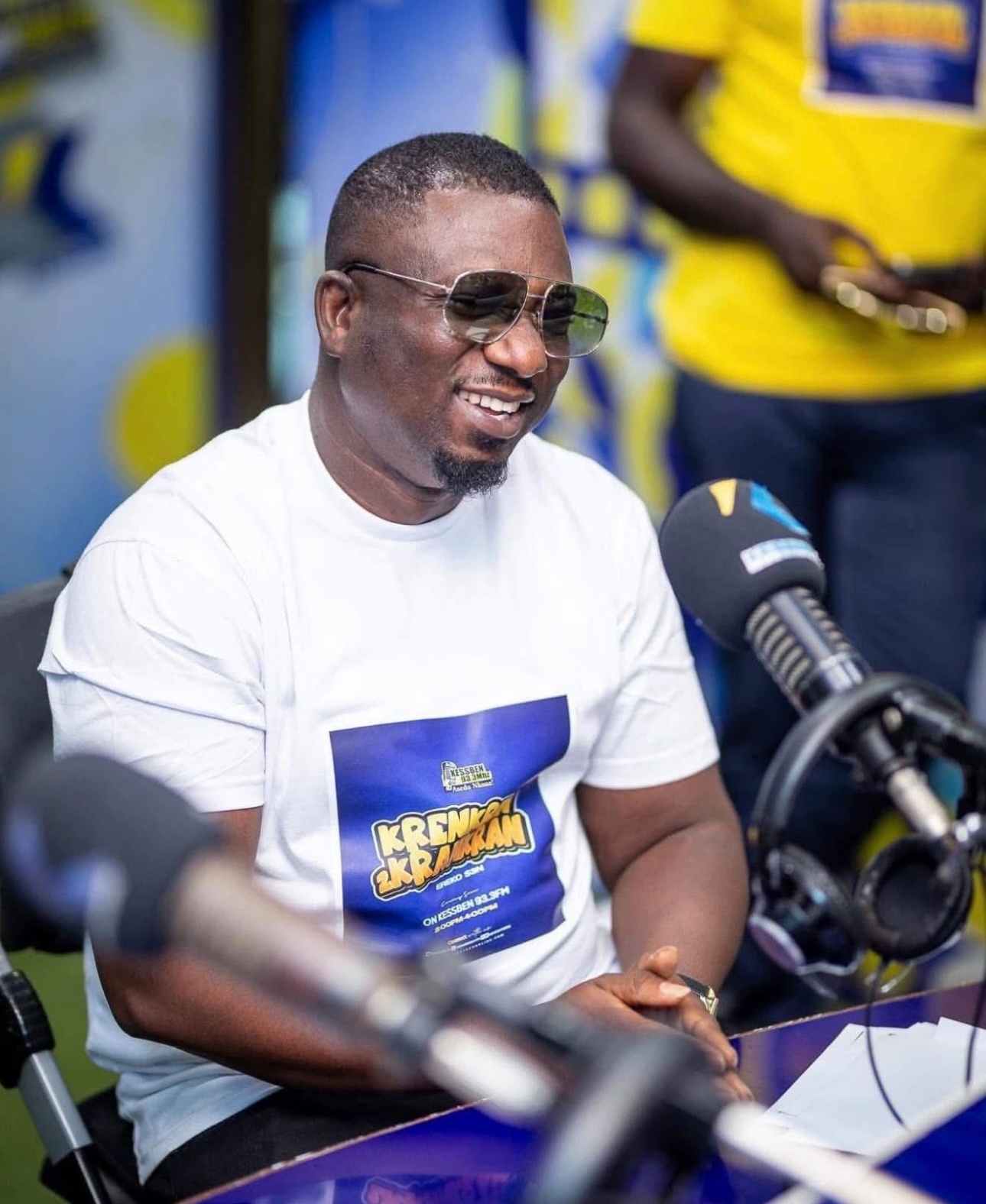 Photo of DJ KA hosting a show on Kessben FM station